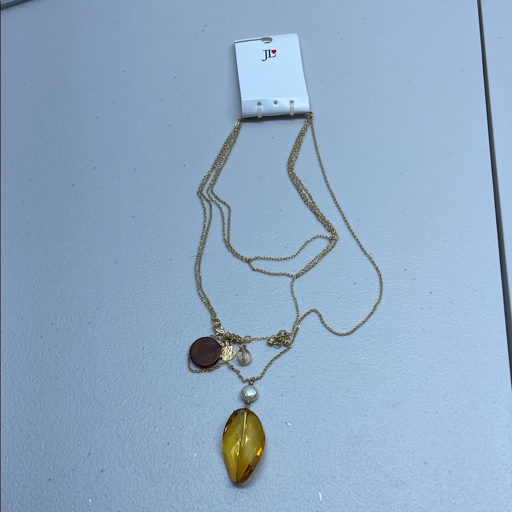Jennifer Lopez Gold Necklace With Yellow And Brown Accents
